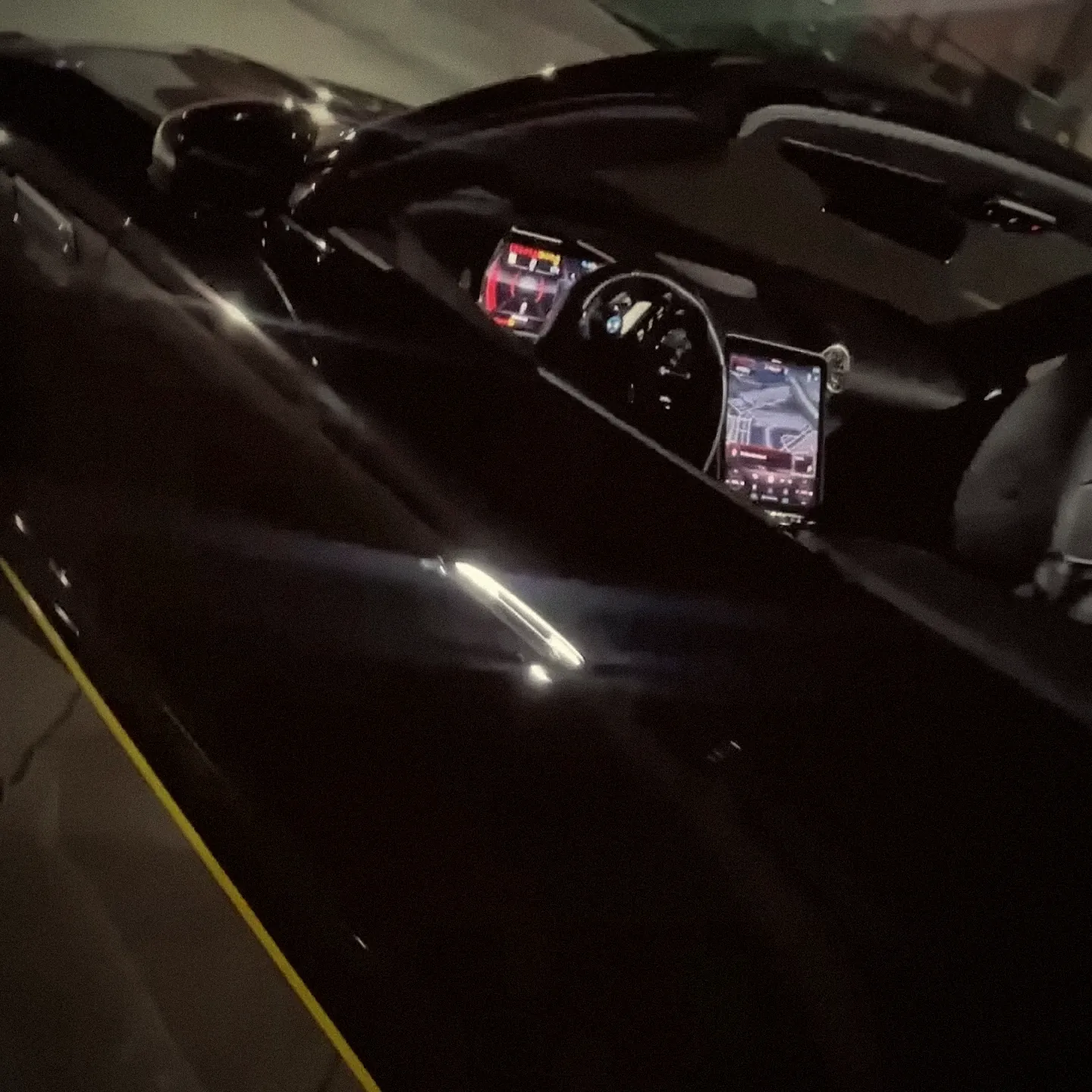 Black Mercedes-Maybach side profile with the cabin screens lit